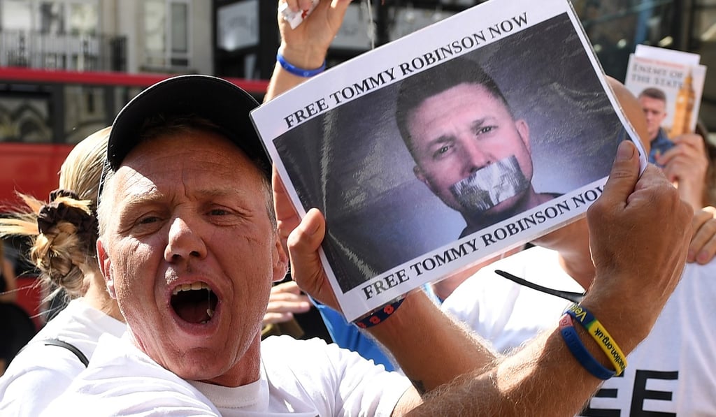 Supporters celebrate outside the High Court in London. Photo: EPA