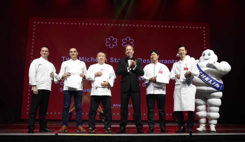 Chefs from the five Singapore restaurants awarded two stars in the 2018 Michelin Guide Singapore on stage at Resorts World Sentosa with Michael Ellis, international director, Michelin Guides. Photo: courtesy of Michelin Guides