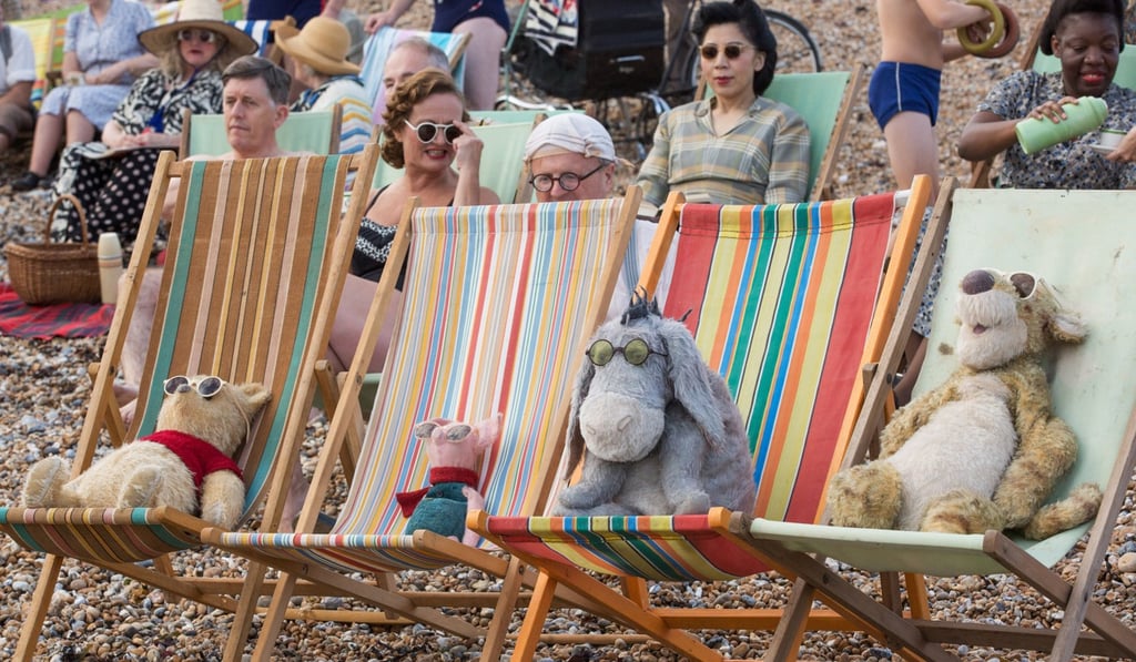 Winnie the Pooh, Piglet, Eeyore and Tigger relax at the beach in Christopher Robin. Photo: Laurie Sparham Winnie the Pooh, Piglet, Eeyore and Tigger relax at the beach in Christopher Robin. Photo: Laurie Sparham