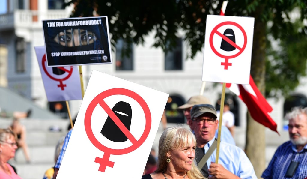 Supporters of the new ban, which includes niqab or burka garments. Critics have said the van is a violation of women’s rights while supporters argue it enables better integration of Muslim immigrants into Danish society. Photo: Ritzau Scanpix via AP Supporters of the new ban, which includes niqab or burka garments. Critics have said the van is a violation of women’s rights while supporters argue it enables better integration of Muslim immigrants into Danish society. Photo: Ritzau Scanpix via AP