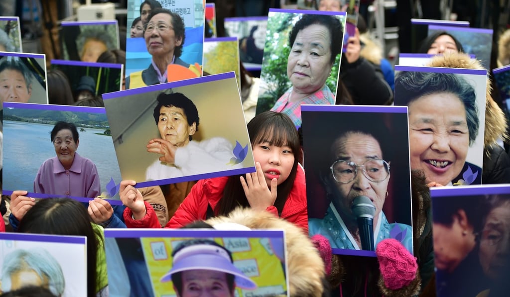 South Korean supporters hold portraits of former “comfort women”, who were forced into wartime sexual slavery for Japanese soldiers, at a rally in front of the Japanese embassy in Seoul on December 30. Photo: AFP