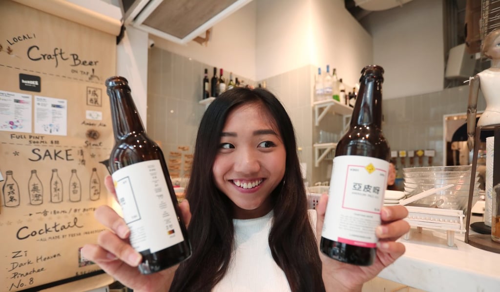 Nutritionist Sisi Yip with bottles of beer at Zi in Tsim Sha Tsui. Photo: Jonathan Wong
