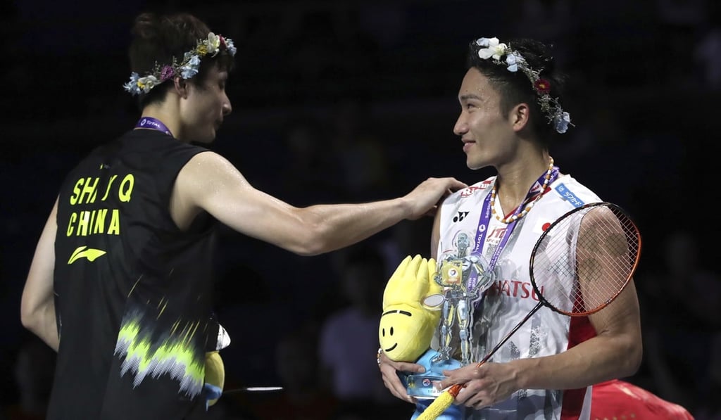 China’s Shi Yuqi (left) congratulates Kento Momota on his victory. Photo: AP