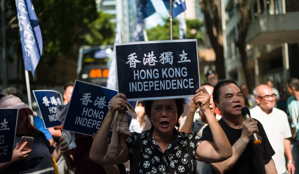 Pro-democracy activists march in a rally on July 21 to protest against a police proposal to ban the pro-independence Hong Kong National Party. Photo: EPA