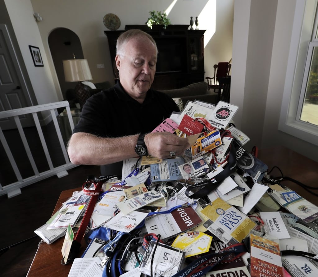 In this July 27, 2018 photo, veteran Associated Press reporter Michael Graczyk looks through some of many media credentials he has collected over his career with the AP, in Montgomery, Texas. Graczyk has witnessed and chronicled more than 400 executions as a criminal justice reporter in Texas. Photo: AP In this July 27, 2018 photo, veteran Associated Press reporter Michael Graczyk looks through some of many media credentials he has collected over his career with the AP, in Montgomery, Texas. Graczyk has witnessed and chronicled more than 400 executions as a criminal justice reporter in Texas. Photo: AP