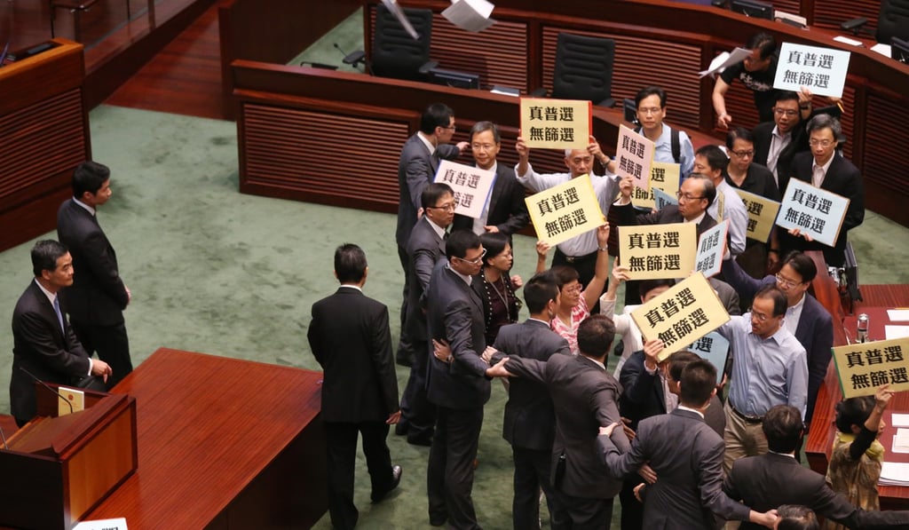 The glass-throwing incident happened during a question-and-answer session of the Legislative Council in Tamar 2014. Photo: K. Y. Cheng