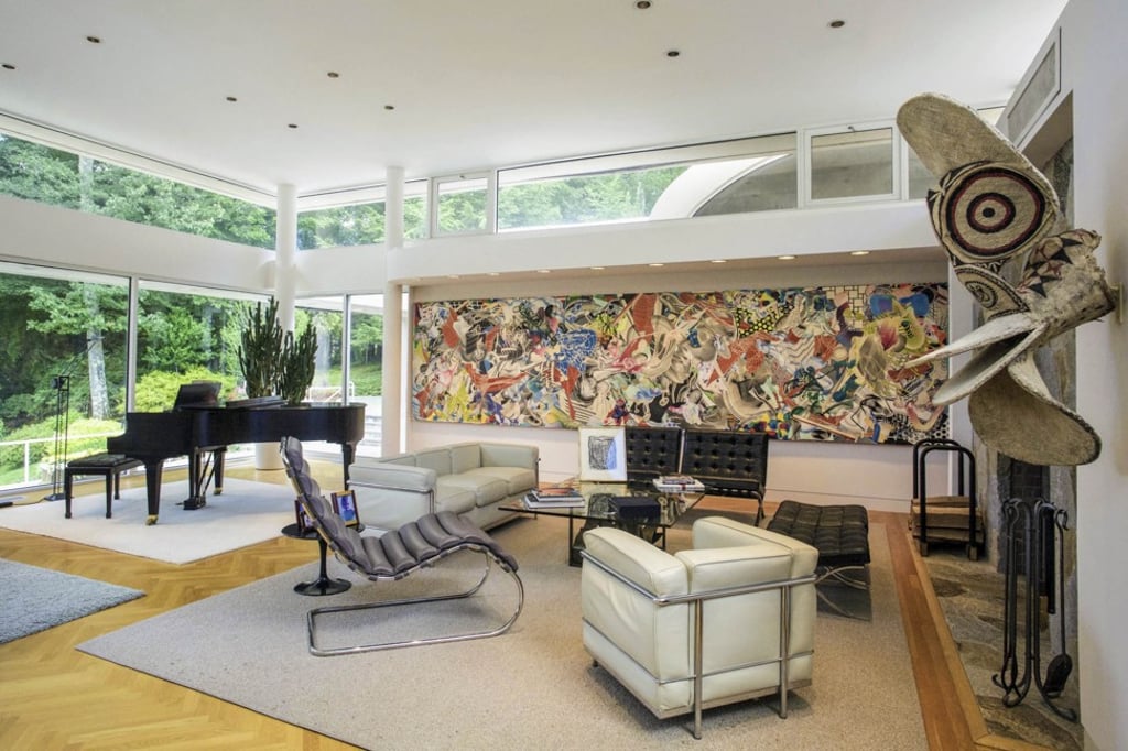 The interior is light-filled, with enough wall space to hang massive pieces of art.