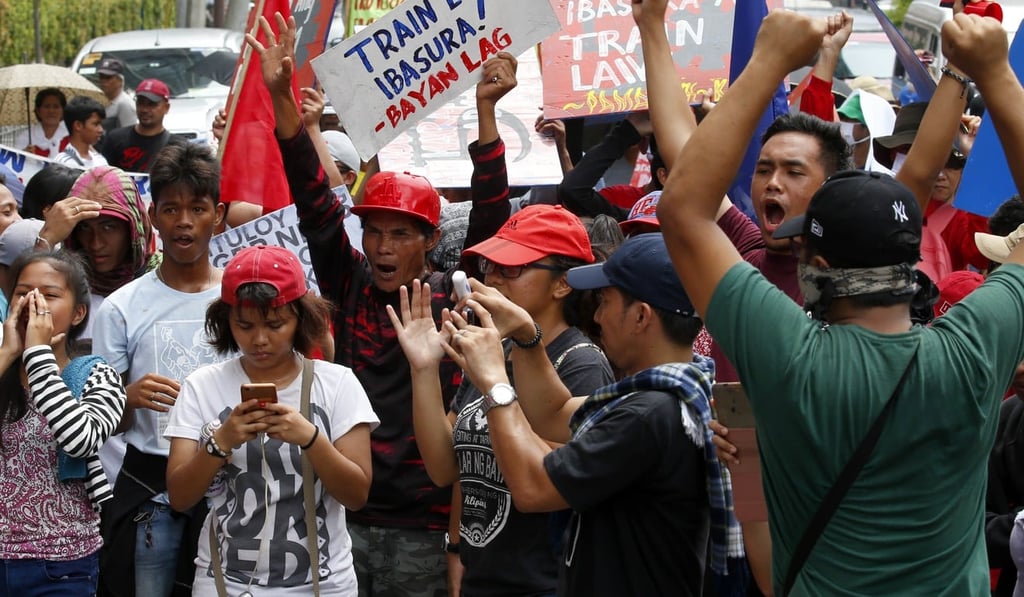 Protesters shout slogans as they arrive at the Chinese consulate for a rally to protest China’s militarisation of the disputed islands, shoals and reefs in the South China Sea on July 21. Photo: AP