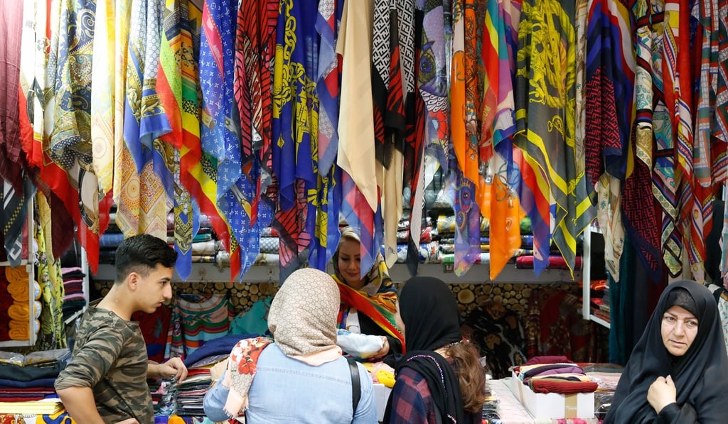 Iranians shopping at the old bazaar in Tehran, a hub of economic activity for the city. Photo: EPA-EFE Iranians shopping at the old bazaar in Tehran, a hub of economic activity for the city. Photo: EPA-EFE