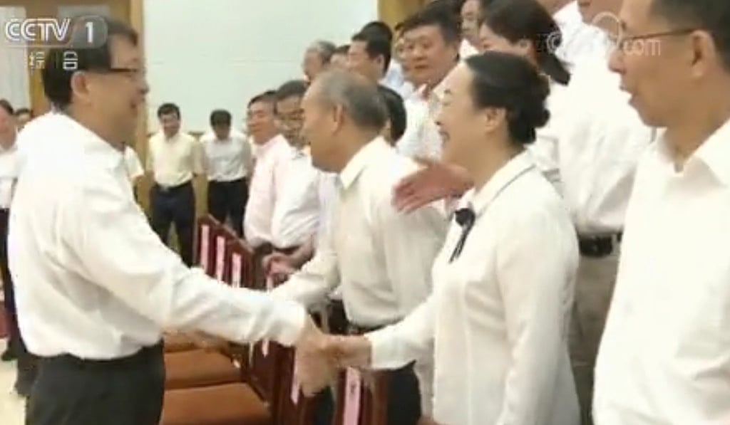 Chen Xi, head of the Central Organisation Department, meets guests at the Beidaihe conclave on Saturday. Photo: CCTV