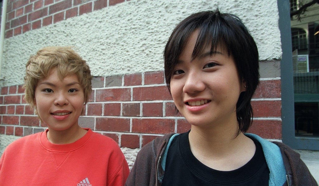 At17 bandmates Eman Lam Yee-man, left, and Ellen Joyce Loo pose for a picture outside the Fringe Club in Central in 2002. Photo: Handout