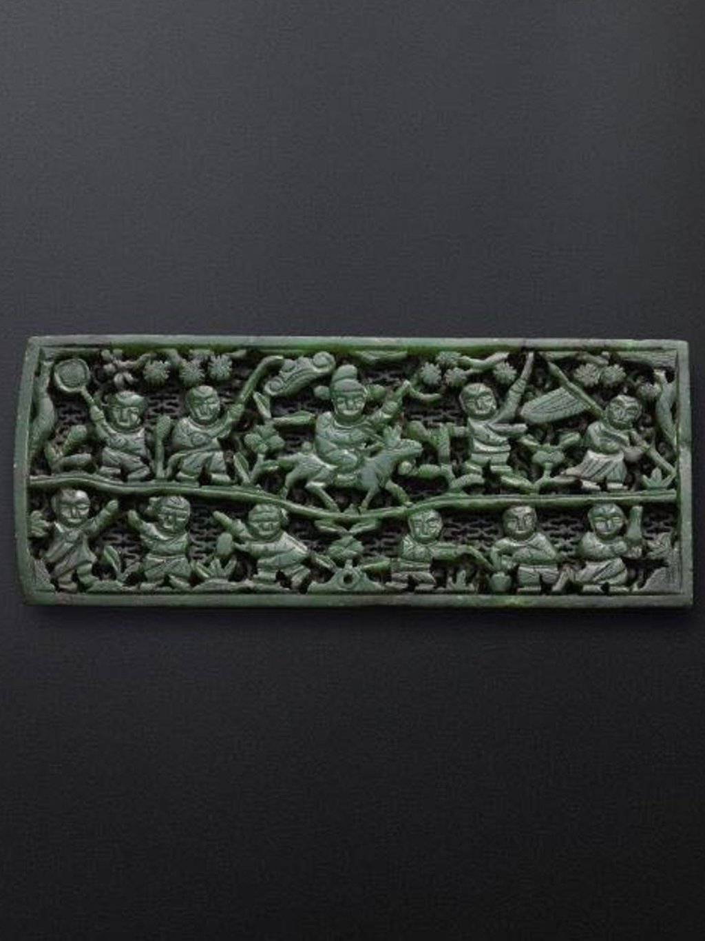 The Chinese green jade belt plaque called ‘Moxiayu’, which depicts children playing a traditional ’groping for fish’ game The Chinese green jade belt plaque called ‘Moxiayu’, which depicts children playing a traditional ’groping for fish’ game