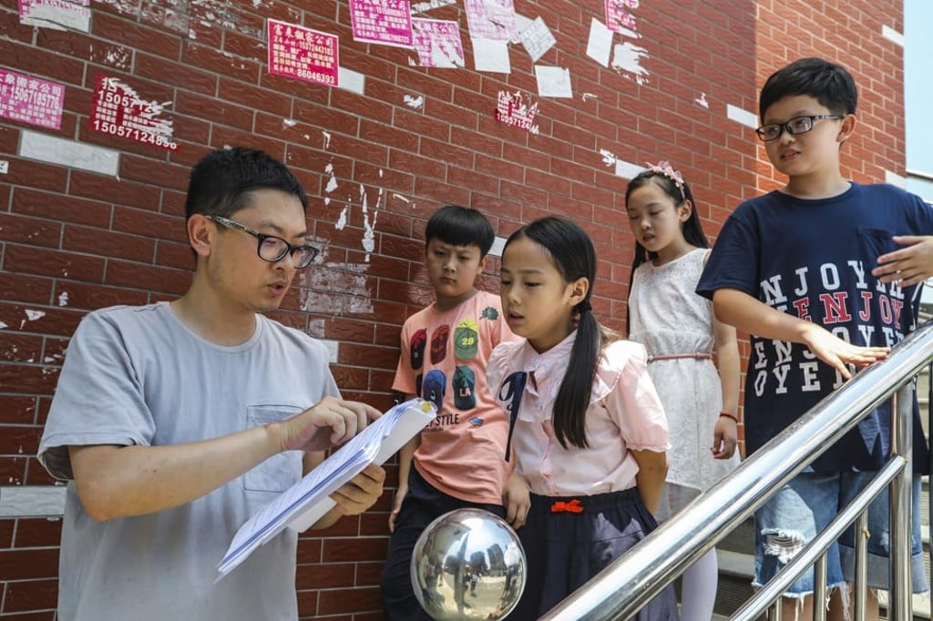 Director Zhou Lipeng and young performers (from left) Li Mingle, Li Jiahang, Guo Rui and Gong Yanning during filming of “Let’s Have a Talk”. Photo: Simon Song