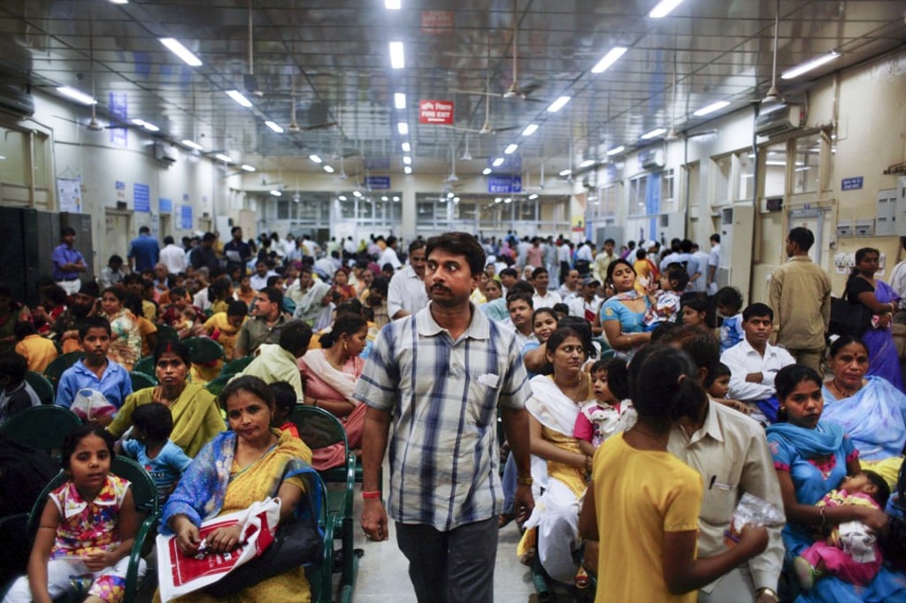 The All India Institute of Medical Sciences waiting room in New Delhi, where families cram into plastic chairs, crouch in corners, crowd doorways, and clog up aisles. Photo: Alamy The All India Institute of Medical Sciences waiting room in New Delhi, where families cram into plastic chairs, crouch in corners, crowd doorways, and clog up aisles. Photo: Alamy