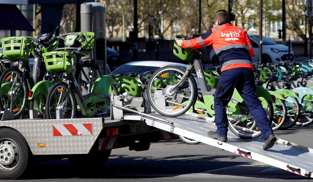 An employee loads a Vélib bicycle onto a truck at a distribution point in Paris. Photo: Reuters