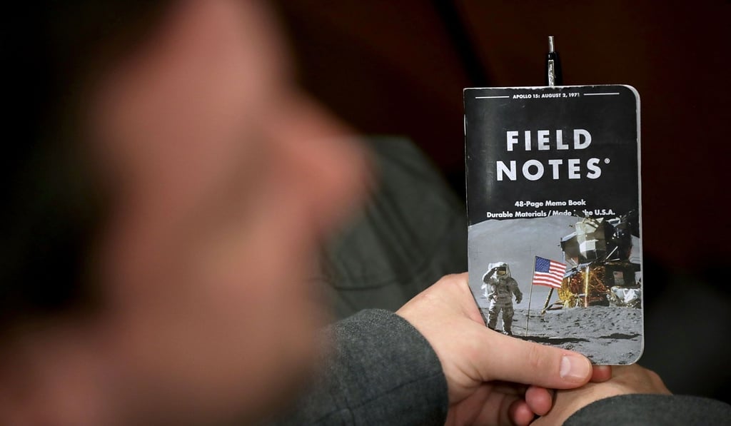 An attendee holds a space-themed notebook before a speech Thursday by US Vice-President Mike Pence on the proposal to create a US Space Force. Photo: Getty Images/AFP