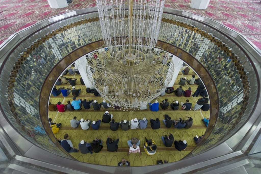 Muslims take part in Friday prayers at the Kowloon Masjid and Islamic Centre in Tsim Sha Tsui. Photo: Bruce Yan