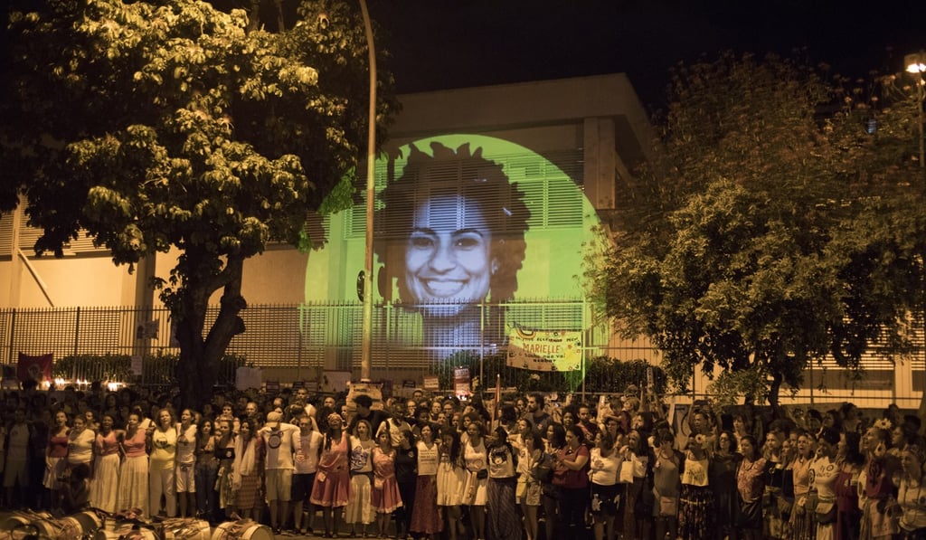 This April 14, 2018 file photo shows an image of slain councilwoman Marielle Franco projected on a wall, where people gather to protest at the site where Franco and her driver Anderson Pedro Gomes were killed, during a protest in Rio de Janeiro, Brazil. Photo: AP This April 14, 2018 file photo shows an image of slain councilwoman Marielle Franco projected on a wall, where people gather to protest at the site where Franco and her driver Anderson Pedro Gomes were killed, during a protest in Rio de Janeiro, Brazil. Photo: AP