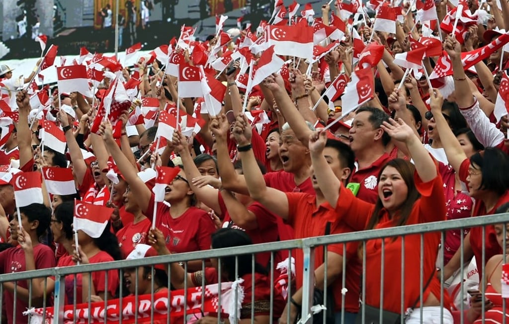 Singaporeans celebrate the country’s 50th National Day in Singapore in 2015. Photo: AFP