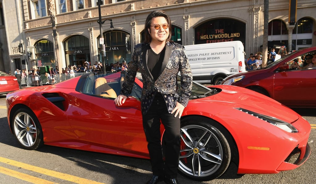 Author Kevin Kwan arrives looking red hot. Photo: AFP