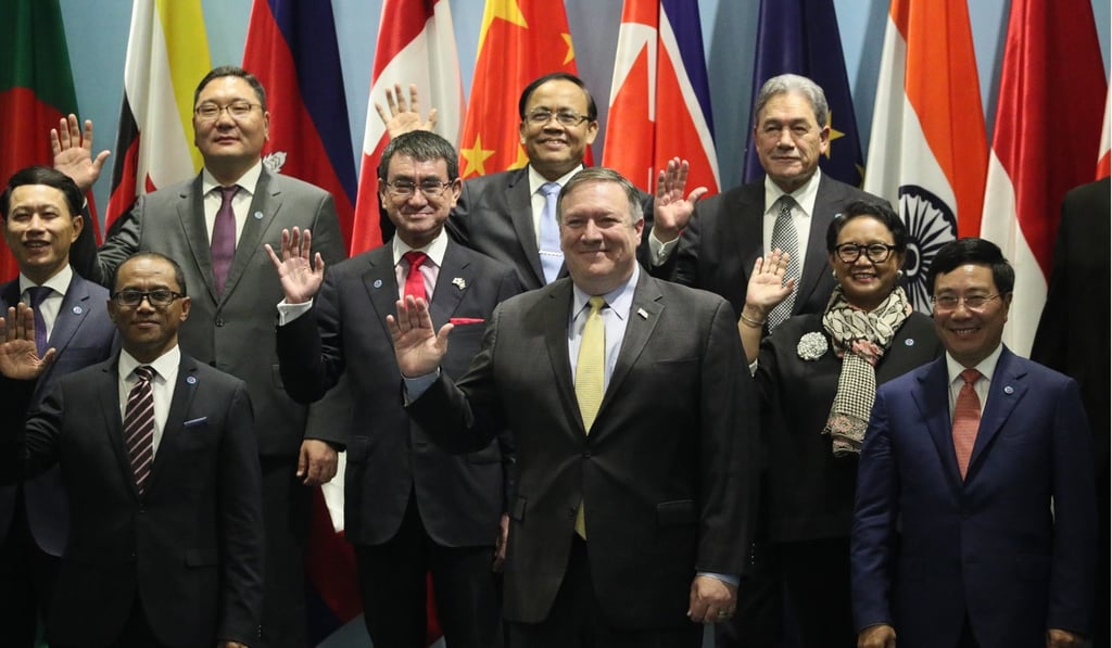 US Secretary of State Mike Pompeo waves while posing for a group photograph with his fellow ministerial delegates during the 51st Asean Foreign Ministers’ Meeting in Singapore on August 4. Photo: EPA-EFE