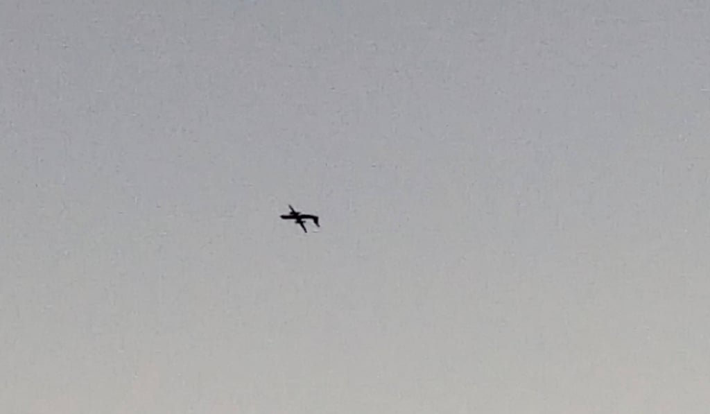 The stolen flies upside down over University Place, Washington state. Photo: John Waldron/Reuters
