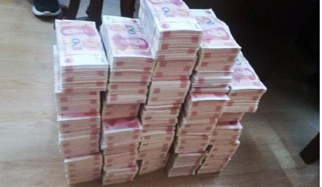 Wang, 26, told police they were selling 100 yuan notes for 8 yuan each. Photo: cqcb.com