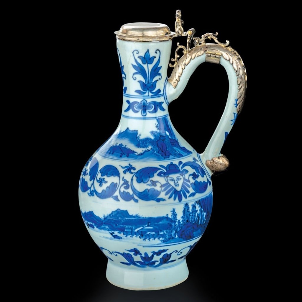 Ewer with decorations of tulips, clowns and landscape features at the East Meets West exhibition. Ewer with decorations of tulips, clowns and landscape features at the East Meets West exhibition.