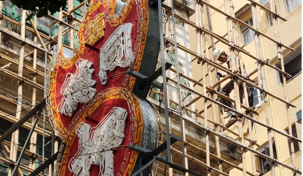 The historic Tung Tak Pawn Shop in Wan Chai is seen here covered in scaffolding. The owner demolished the three-storey building to make way for a commercial high-rise. Photo: Edward Wong