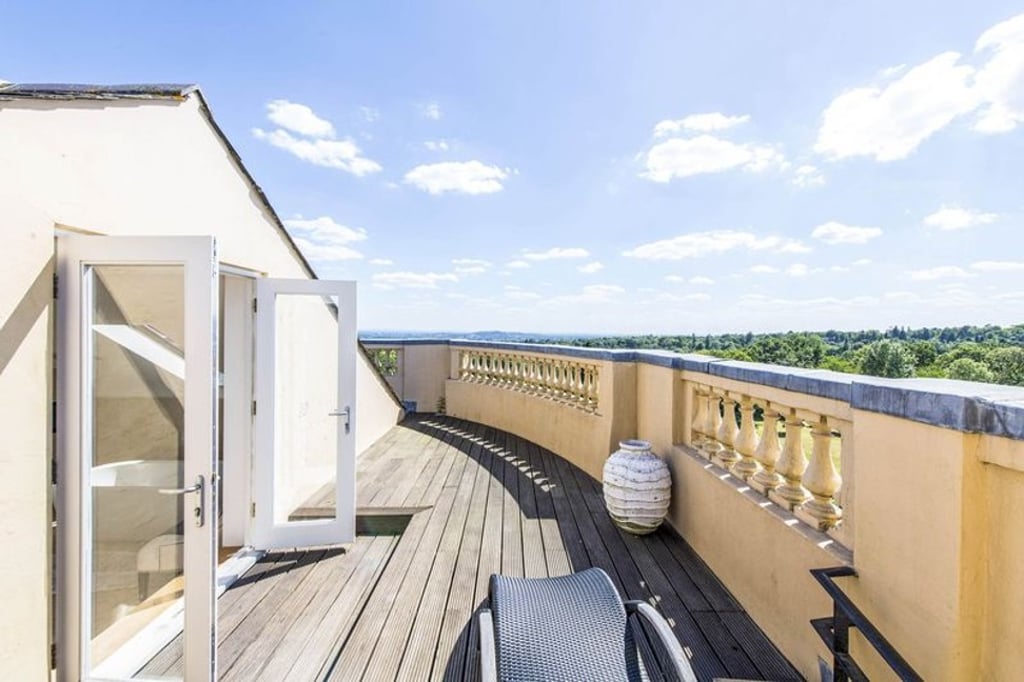 Bentley Priory’s penthouse flat has three terraces, which offer sweeping views of London in the distance. Photo: Savills