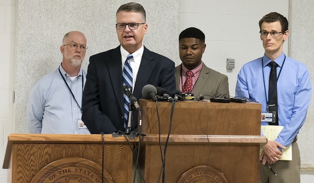 From left, media witnesses Brent Martin of Nebraska Radio Network, Joe Duggan of the Omaha World-Herald, Chip Matthews of News Channel Nebraska and Grant Schulte of The Associated Press answer questions after the execution of Carey Dean Moore on Tuesday at the Nebraska State Penitentiary. Photo: AP From left, media witnesses Brent Martin of Nebraska Radio Network, Joe Duggan of the Omaha World-Herald, Chip Matthews of News Channel Nebraska and Grant Schulte of The Associated Press answer questions after the execution of Carey Dean Moore on Tuesday at the Nebraska State Penitentiary. Photo: AP