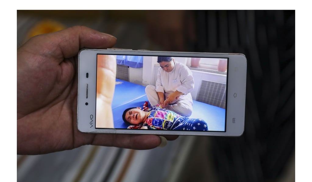 A mobile phone image of Lu Pengyinuo receiving treatment in Beijing last year. Photo: Simon Song