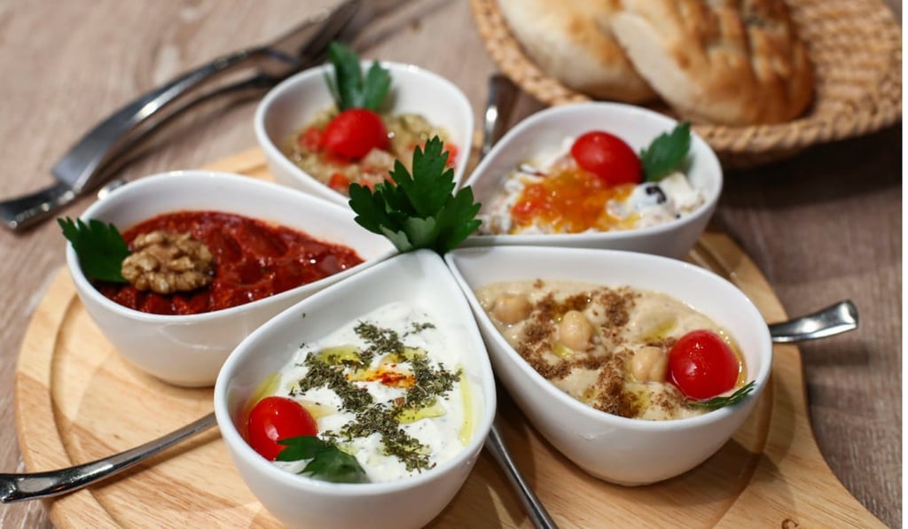Cold mezzes including the smoky eggplant delice and muhammara. Photo: Edmond So