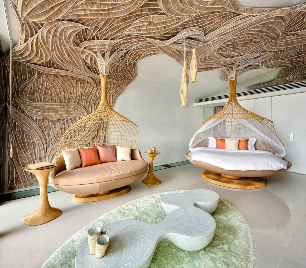 Eggarat Wongcharit’s interior décor at Iniala’s Villa Siam includes woven tattoo canopies, bronze lotus leaves and ceiling-suspended sofas.