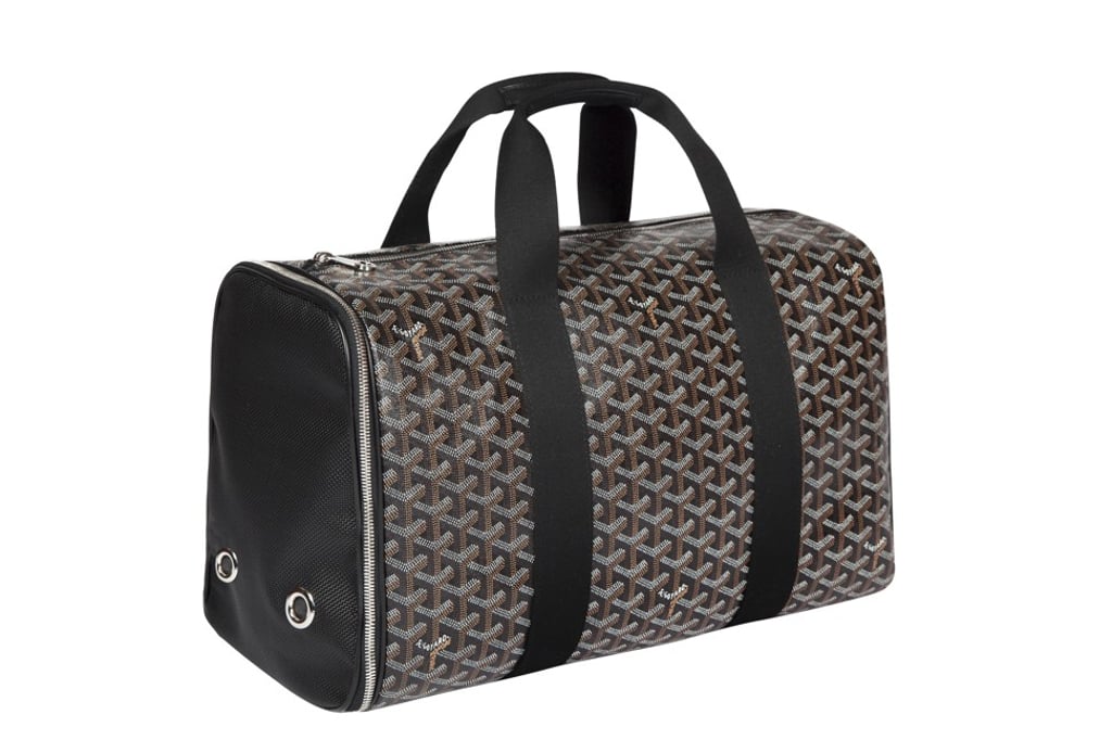 Goyard. The Voltigeur Pet Travel Bag with pared back lines is designed for air travel. The light weight will guarantee a comfortable journey for Fido. Price on request Goyard. The Voltigeur Pet Travel Bag with pared back lines is designed for air travel. The light weight will guarantee a comfortable journey for Fido. Price on request