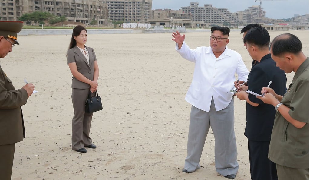 North Korean leader Kim Jong-un and his wife Ri Sol-ju inspecting a building site in Kangwon province. Photo: AFP