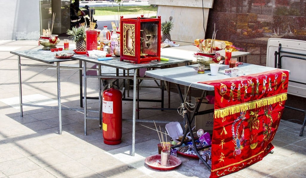 A makeshift Chinese altar is erected at a street corner to make offerings to spirits during the Hungry Ghost Festival.