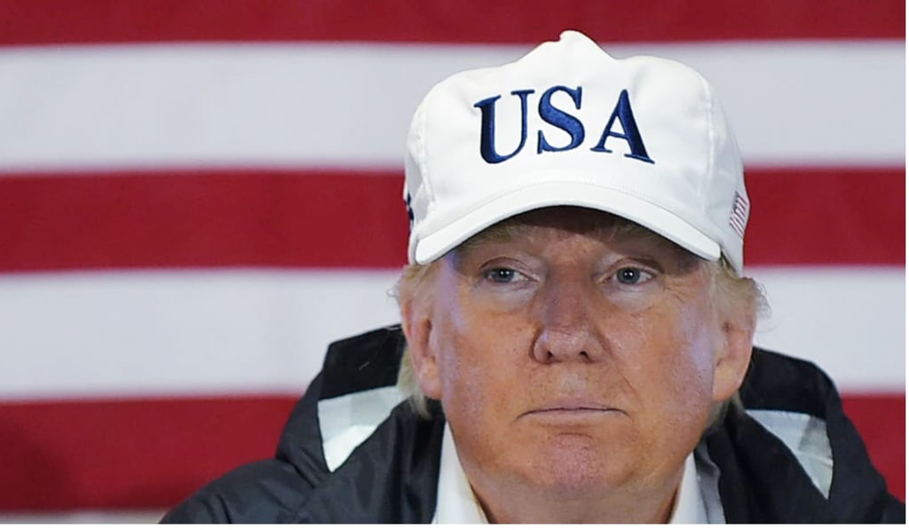 US President Donald Trump attends a briefing with senior military personnel aboard the USS Kearsarge, off Puerto Rico on October 3, 2017. Photo: Agence France-Presse