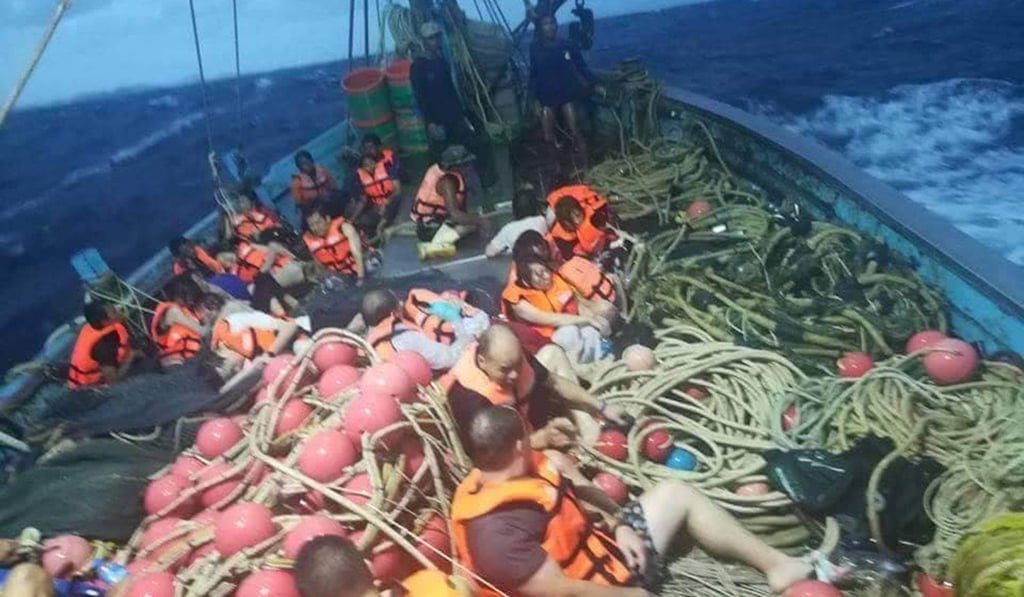 Some of the tourists rescued after their boat sank in a storm. Photo: Xinhua
