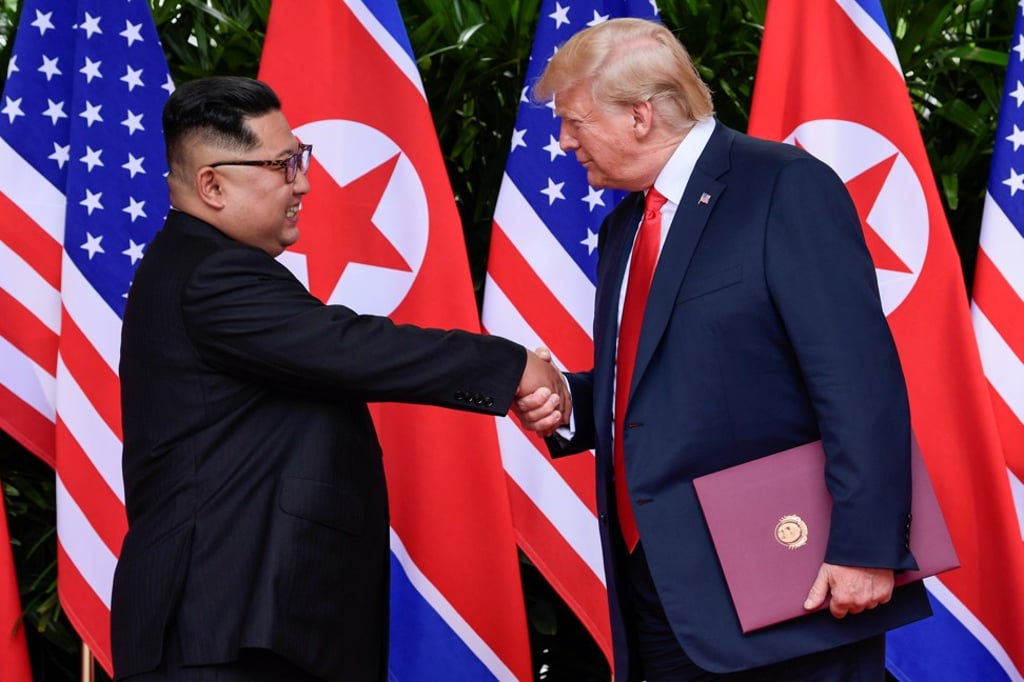 US President Donald Trump and North Korean leader Kim Jong-un shake hands after their summit in Singapore. Photo: Reuters