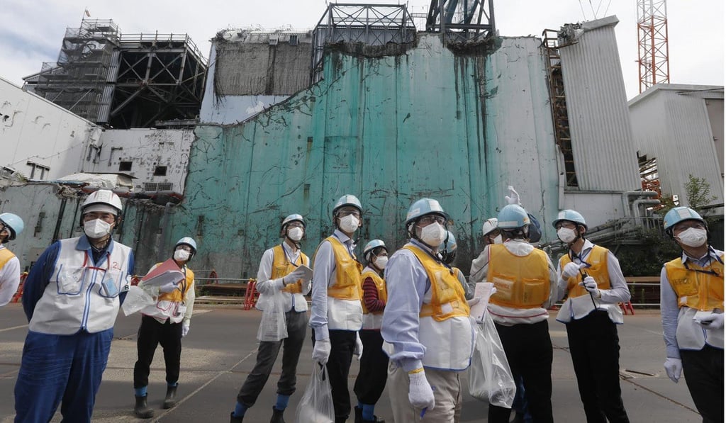 Foreign journalists on a tour of the nuclear plant. Photo: AFP
