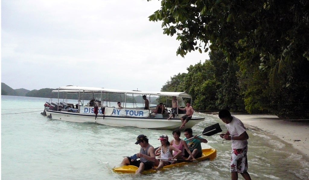 Tourists set off on a boating tour off the coast of Palau. The island is now trying to boost its tourism sector following the ban on mainland Chinese tour parties. Photo: EPA-EFE