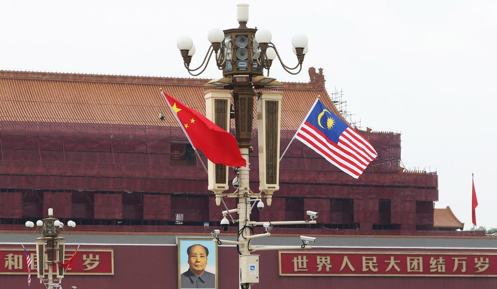 Chinese and Malaysian flags flying in Tiananmen Square, Beijing on August 19, 2018. Photo: Reuters