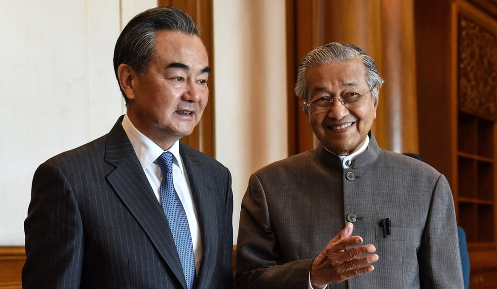 Chinese Foreign Minister Wang Yi with Malaysian Prime Minister Mahathir Mohamad in Putrajaya. Photo: Agence France-Presse