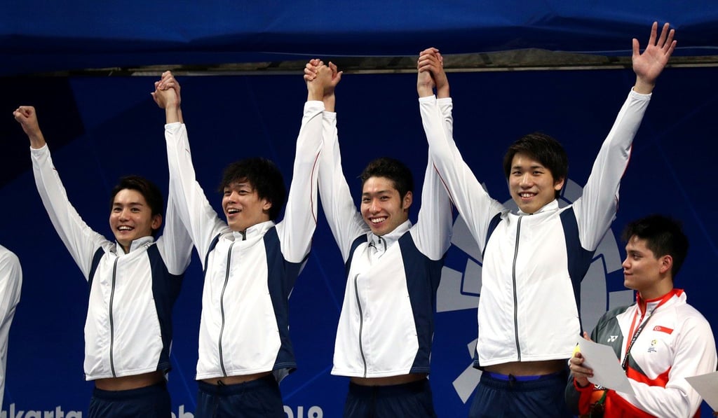 Japan’s Naito Ehara, Reo Sakata, Kosuke Hagino and Katsuhiro Matsumoto celebrate on the podium. Photo: Reuters