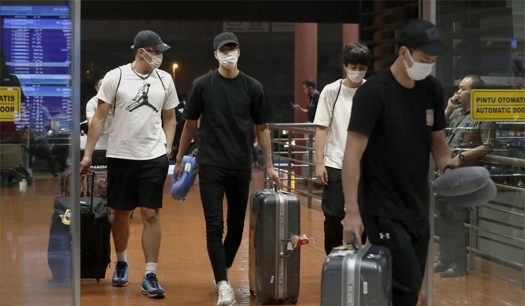 The four Japanese basketball players arrive at Jakarta airport on Monday. Photo: AP The four Japanese basketball players arrive at Jakarta airport on Monday. Photo: AP
