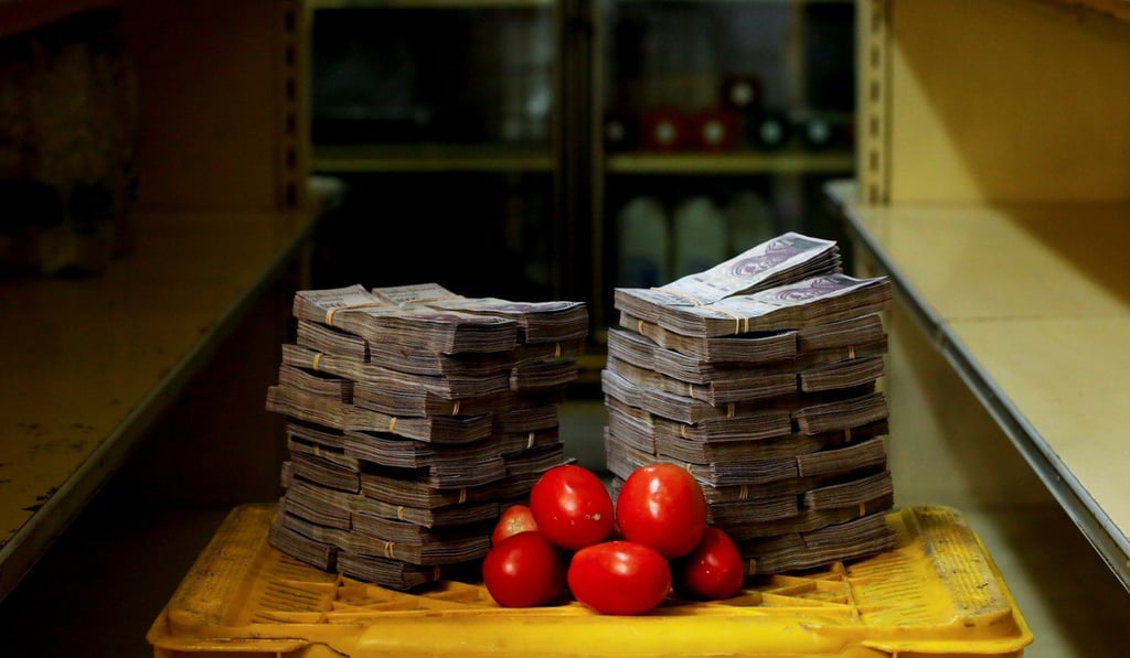 A kilogram of tomatoes is pictured next to its 5 million price in Bolivars at a mini-market in Caracas on Friday, ahead of Monday’s currency devaluation. Photo: Reuters
