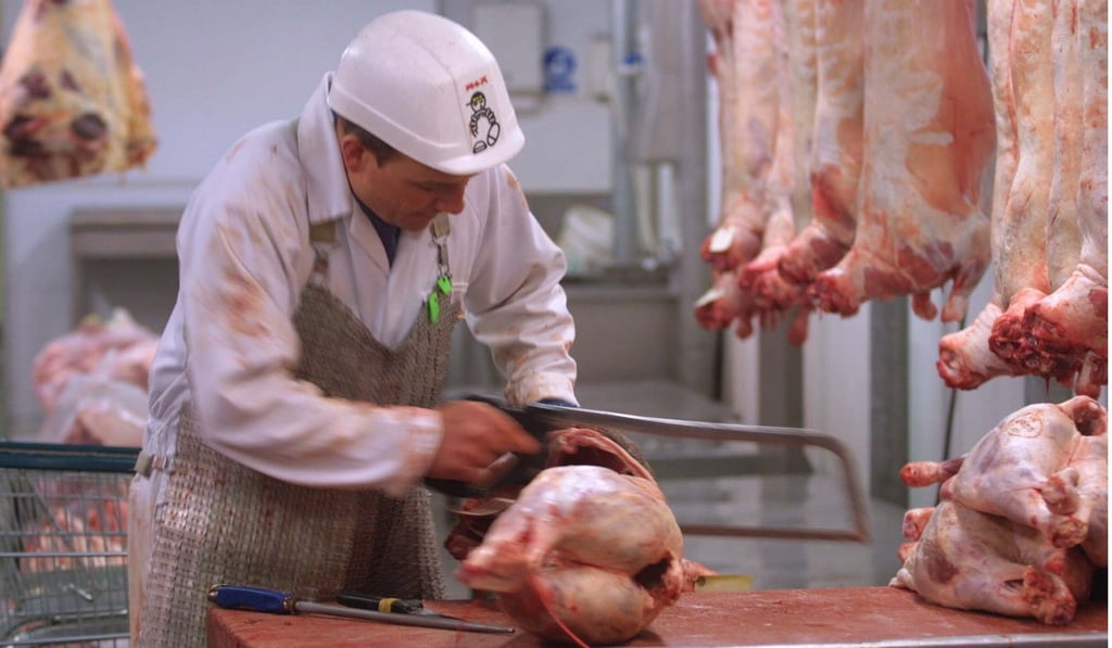 A butcher at Smithfields Market in central London prepares British lamb in this file photo. Photo: AP