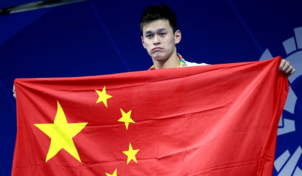 China's Sun Yang stands on the podium after men's 400m freestyle final. Photo: AP China's Sun Yang stands on the podium after men's 400m freestyle final. Photo: AP