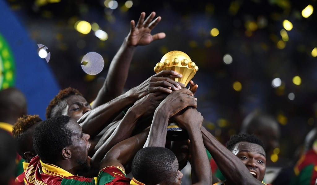 Cameroon team players hold up the trophy as they celebrate winning the 2017 Africa Cup of Nations. Photo: AFP
